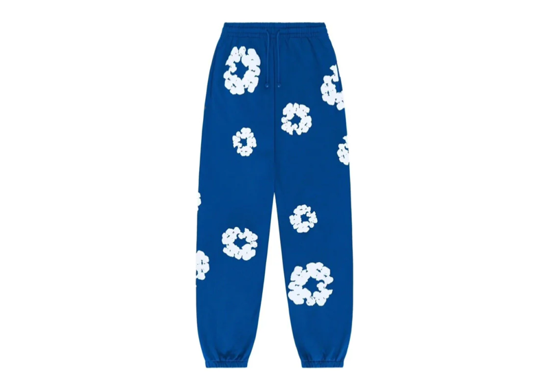 Denim Tears Cotton Wreath Sweatpants Royal Blue with white wreath pattern.