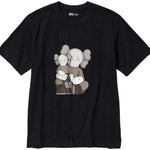 KAWS x Uniqlo UT black graphic T-shirt featuring iconic character design.