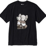 KAWS x Uniqlo UT black graphic T-shirt featuring iconic character design.