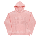 LAST LESSON pink Starboy hoodie with front zip and text design.