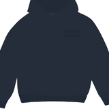 Broken Planet Basics navy hoodie with hood and cuffed sleeves.